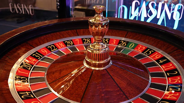 Live Sic Bo dealer at yok casino table with transparent dice shaker